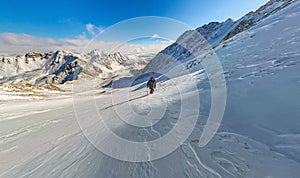 Wide-angle view of a mountain hiker to climb a mountain of snow