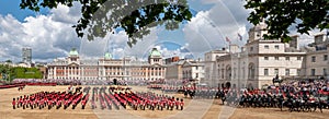 Wide angle view of the Trooping the Colour military parade at Horse Guards Parade, London UK, with Household Division soldiers.
