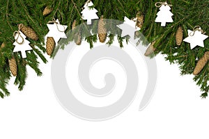 Wide arch shaped Christmas border isolated on white, composed of fresh fir branches, cones and wood decorations