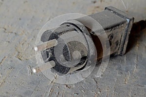 Wide black plastic plug for socket