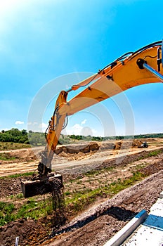 Wide Close-up of excavator while working in construction