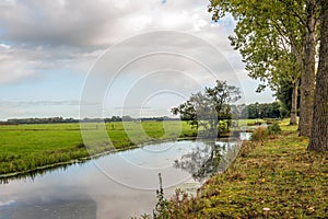 Wide ditch with a row of small bridges photo