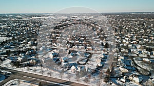 Wide drone panoramic aerial view of a winter Naperville IL, city with a private sector