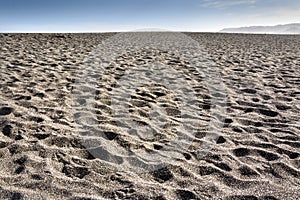 Dark sand beach on the coast of Cobquecura, Chile. photo