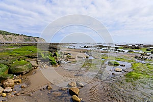 Wide expanse of rock strewn foreshore at Robin Hoods Bay