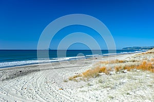 Wide expansive white sand beach photo