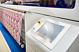 Wide format printer for on fabric and paper