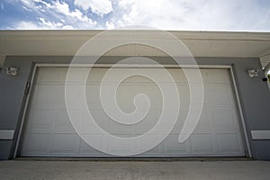 Wide garage double door and concrete driveway of new modern american house