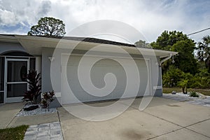 Wide garage double door and concrete driveway of new modern american house