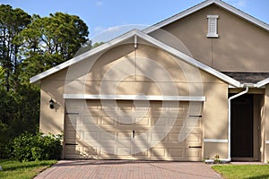 Wide garage double door and concrete driveway of new modern american house