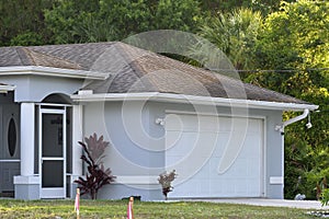 Wide garage double door and concrete driveway of new modern american house