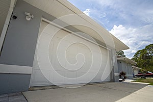 Wide garage double door and concrete driveway of new modern american house