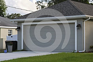 Wide garage double door and concrete driveway of new modern american house