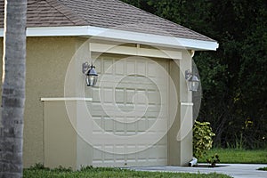 Wide garage double door and concrete driveway of new modern american house