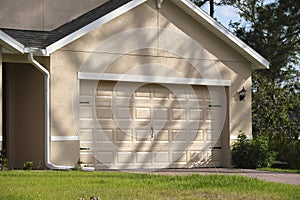 Wide garage double door and concrete driveway of new modern american house