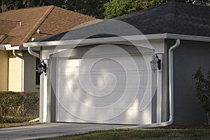 Wide garage double door and concrete driveway of new modern american house