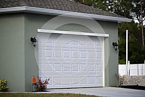 Wide garage double door and concrete driveway of new modern american house