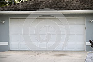 Wide garage double door and concrete driveway of new modern american house