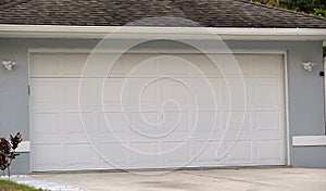 Wide garage double door and concrete driveway of new modern american house