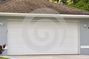 Wide garage double door and concrete driveway of new modern american house