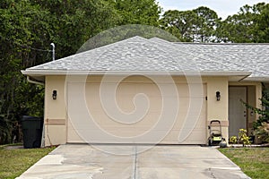 Wide garage double door and concrete driveway of new modern american house