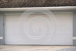 Wide garage double door and concrete driveway of new modern american house