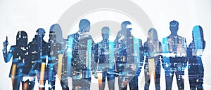 Wide image of businesspeople silhouettes standing on abstract night city background with forex chart. Teamwork, finance and
