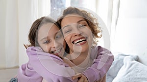 Wide image portrait of happy mom and teen daughter hugging
