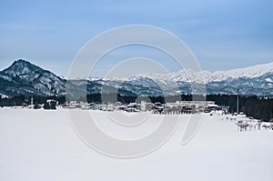 Wide landscape of small village and mountain range in Fukushima, Tohoku, Japan in Winter time landscape