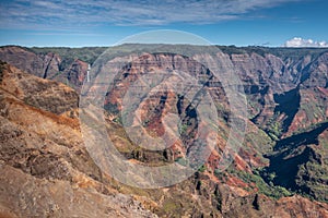 Wide landscape with waterfall in distance at Waimea Canyon, Kauai, Hawaii, USA