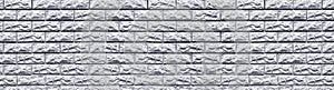 Wide light gray white washed stone block masonry vintage background. Panoramic whitewashed brick wall texture