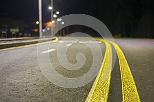 Wide modern smooth empty asphalt highway sharp turn sharp with bright white and double yellow marking sign line. Speed, safety,