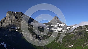 a wide morning view of mt clements and reynolds mountain near logan pass at glacier national park