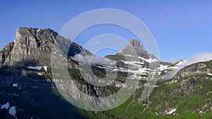 Wide morning view of mt clements and reynolds mtn in glacier national park