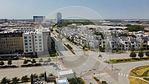 Wide open aerial view mixed of multistory office buildings, apartment towers and luxury villa residential houses along