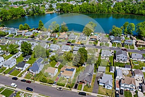 Wide panorama, aerial view with tall single home, in the beautiful residential quarters Sayreville town near pond New