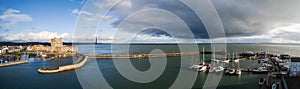 Wide Panorama of Carrickfergus castle and marina near Belfast