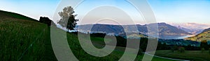 Wide panorama of mountains i Switzerland with view of Zug and Rigi