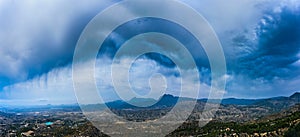 Wide panorama of storm clouds over Spain mountains