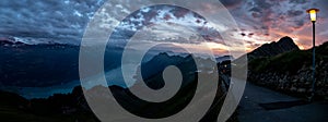 wide panorama view of mountain range during dramatic snuset from the brienzer rothorn in the swiss alps