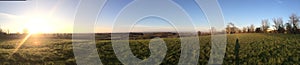 Wide panoramic landscape with blue sky and sunset