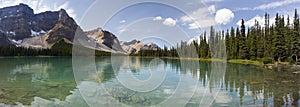 Wide Panoramic Landscape of Scenic Bow Lake and Rocky Mountain Peaks in Banff National Park, Alberta Canada