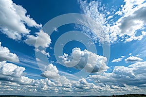 Cloudscape with blue sky and white clouds photo