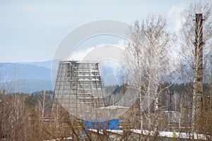 Wide pipe of thermal station from which steam comes out