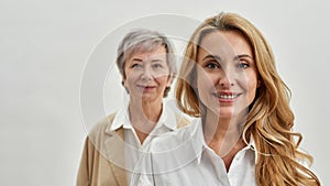 Wide portrait of smiling two women generations