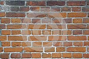 Wide red brick wall texture. Old rough orange brickwork abstract backdrop.