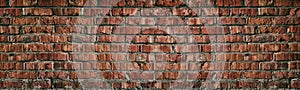 Wide red brick wall texture. Old rough orange brickwork widescreen backdrop. Grunge panoramic large background