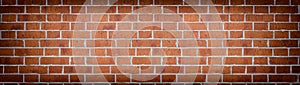 Wide red brick wall texture. Rough brickwork widescreen backdrop. Large long abstract background