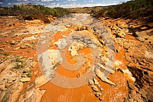 Wide river bed Betsiboka, flushes red soil after heavy rains in Madagascar photo