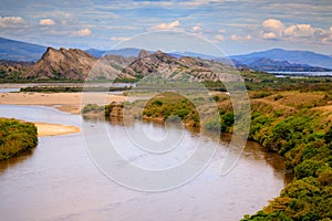 Wide river and rock mountains photo